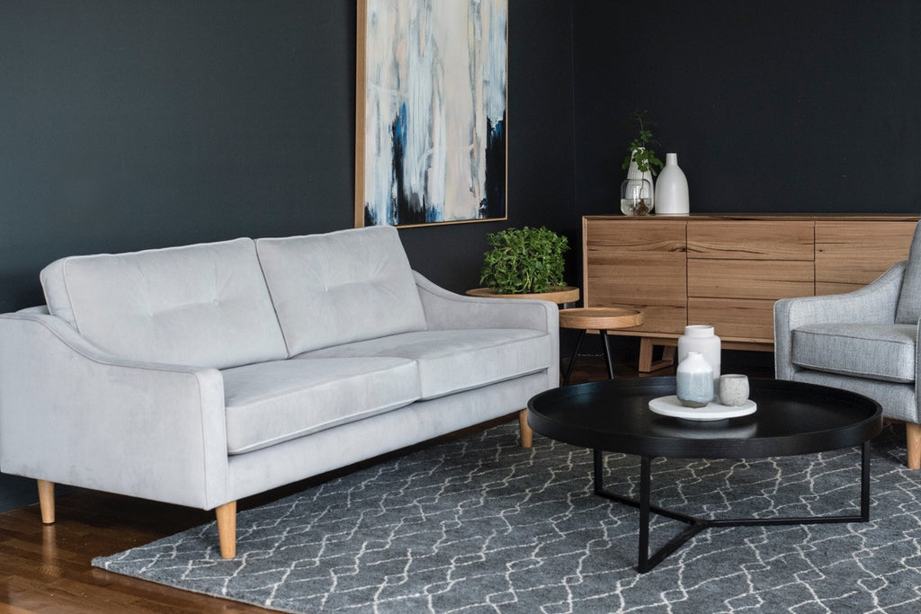 Liza sofa in a 2.5 seat, in a plush light grey velvet styled with the Baxter Buffet, Nordic rug and black round tivoli coffee table.